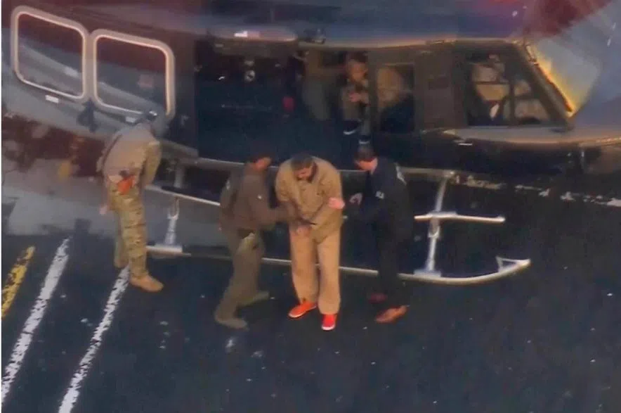 Maduro escorted off helicopter