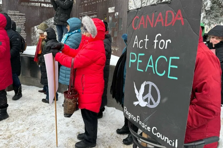 Members of the Regina Peace Group, Regina Peace Council and Making Peave Vigil took place in the protest at Regina's city hall on Monday, (Nicole Garn/980 CJME)