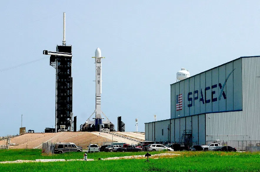 A Falcon 9 SpaceX rocket stands ready for launch at pad 39A at the Kennedy Space Center in Cape Canaveral, Fla., Friday, June 26, 2020.