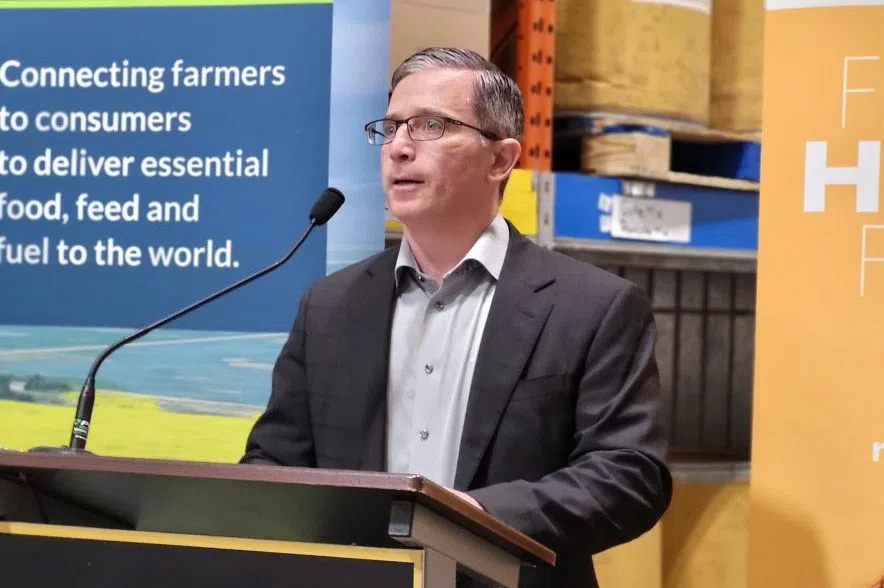 Bunge Canada CEO Kyle Jeworski speaks at a podium with a microphone.