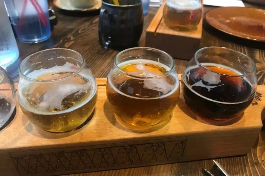 A flight of beer in glasses.