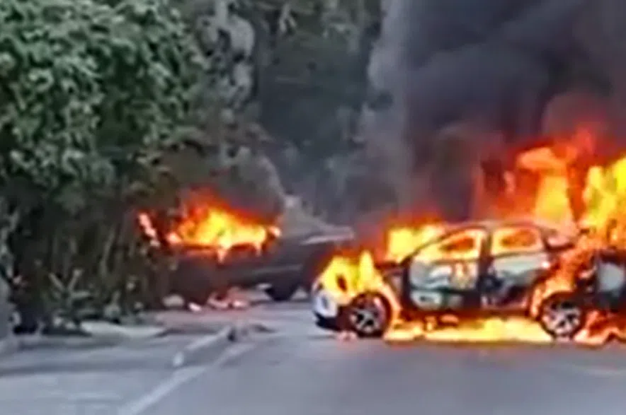 Barricade constructed with burning vehicles.