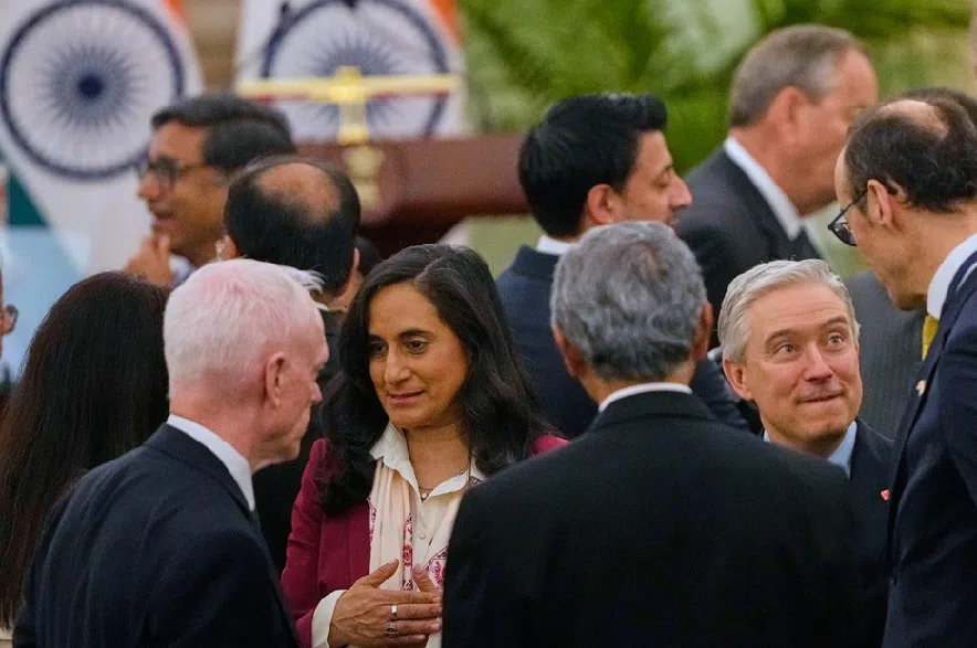 Canadian Finance Minister François-Philippe Champagne, right, and Canadian Foreign Minister Anita Anand, second left, talk to Indian ministers and officials as they wait for the signing of agreement and memorandum of understanding ceremony in New Delhi, India, Monday, March 2, 2026.