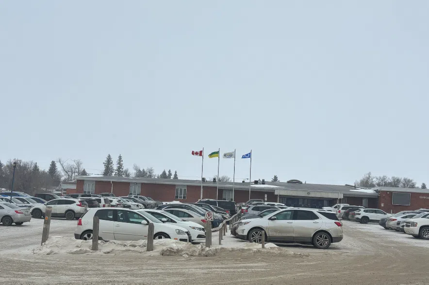 Cars are parked in the lot in front of Balgonie's Greenall High School on March 4, 2026.