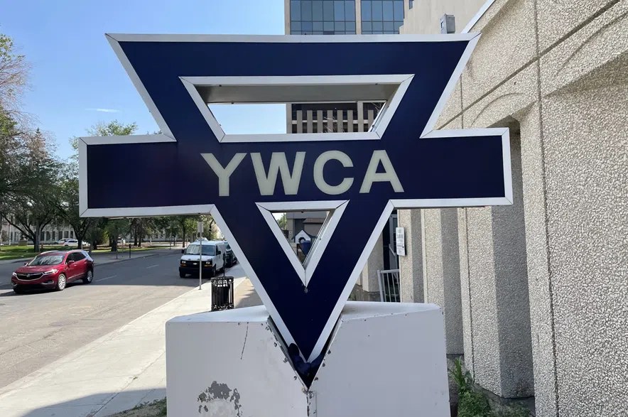 A sign displaying the YWCA's logo outside the organization's building in Regina.