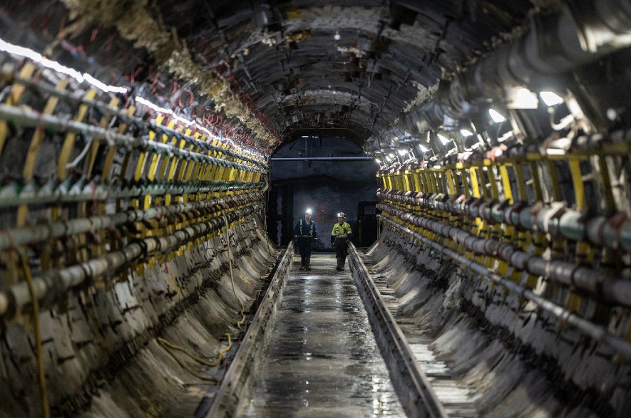 Cameco employees walk down a tunnel to a Jet Boring System machine at Cameco's Cigar Lake uranium mine.