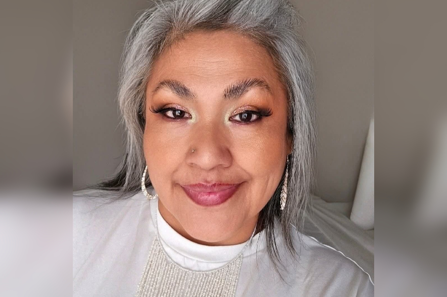Kerry Benjoe smiles in a portrait photo.
