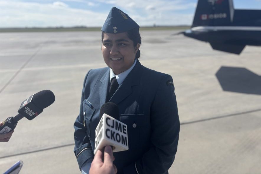 Second Lieutenant Rhea Panashtia speaks with reporters on the tarmac at 15 Wing Moose Jaw.