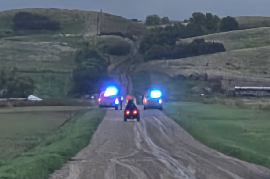 Emergency vehicles block the road to the area believed to be the site of the aircraft accident near Kisbey, Sask., Friday, Sept. 18.