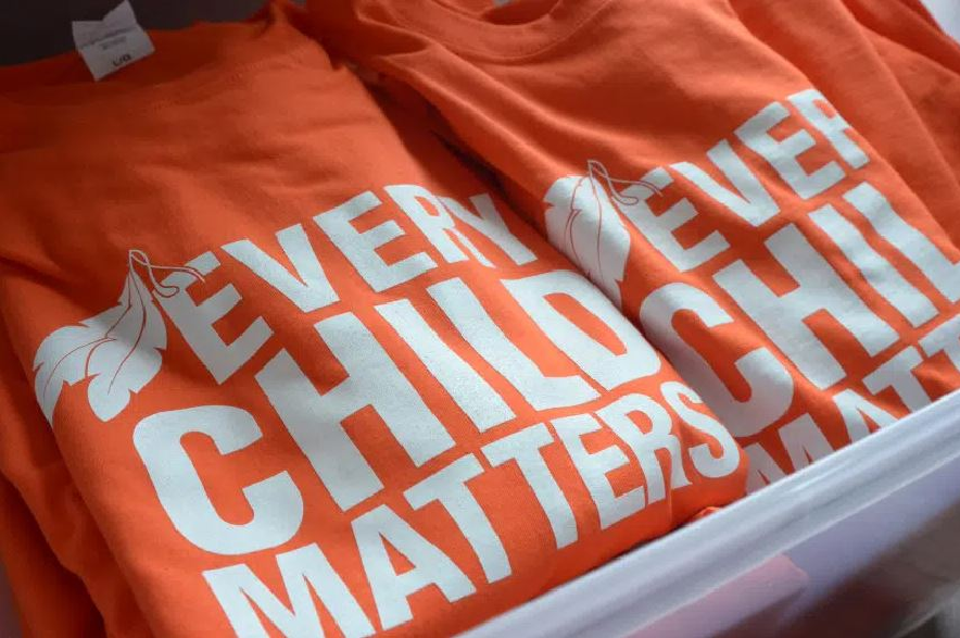 The origin story from the orange shirt comes from residential school survivor Phyllis Webstad. She wore an orange shirt to school and it was taken away from her.