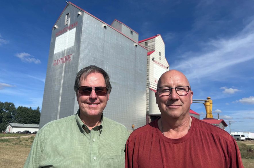 Tom Benson (left) and Duane Kirstein stand outside the Raymore elevator