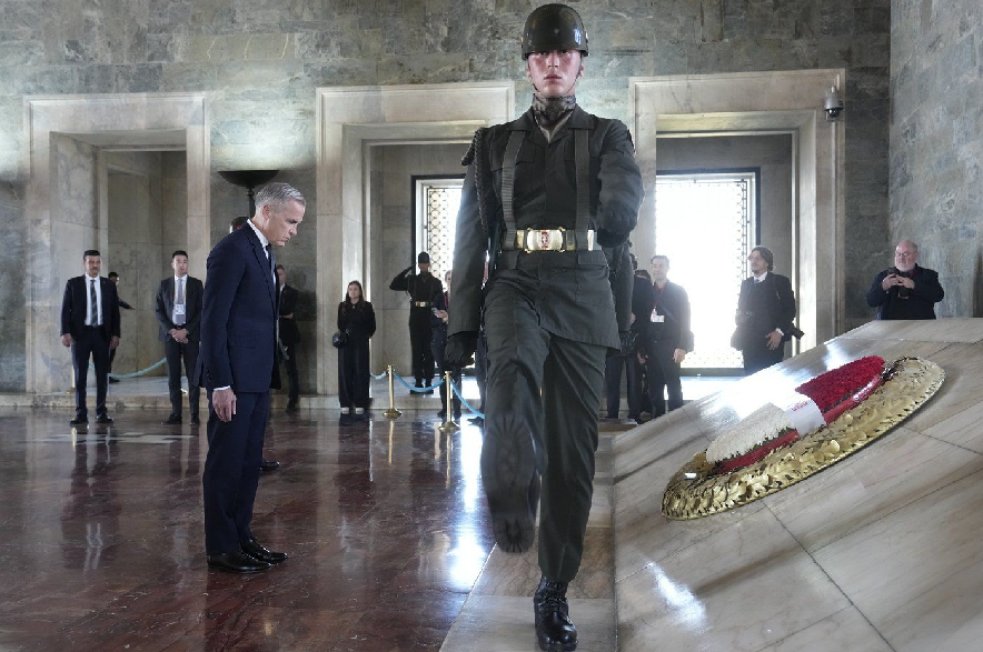 Prime Minister Mark Carney bows his head after laying a wreath at the mausoleum of Turkish founding father Mustafa Kemal Ataturk in Ankara, Turkey, on Thursday, Oct. 22, 2026.