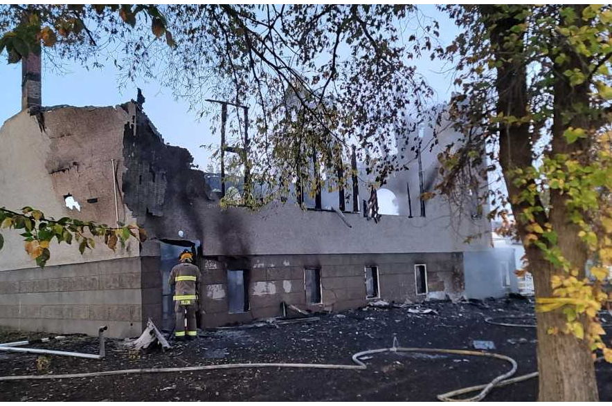 A firefighter dampens hotspots after the Oct. 1 fire.