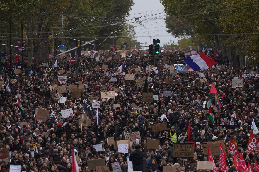 Protesters march during a demonstration against rising living costs in Paris.