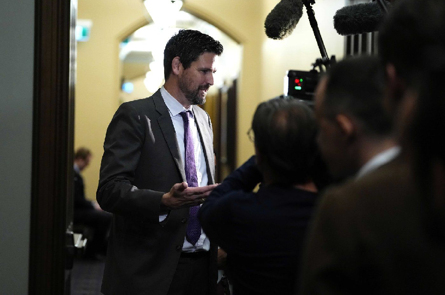 Minister of Justice Sean Fraser responds to questions from journalists before a meeting of the Liberal caucus on Parliament Hill on Wednesday, Oct. 21, 2026.