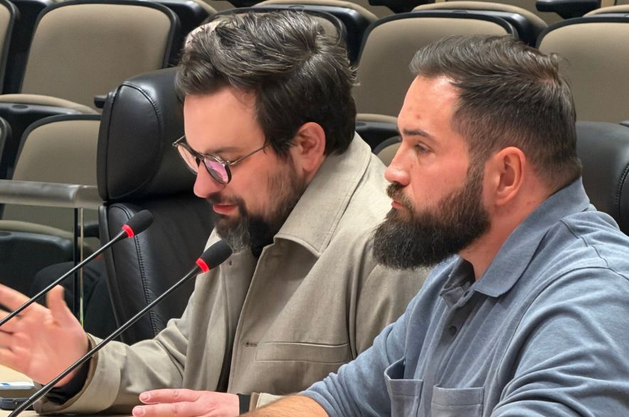 Jaethan Reichel and Dan Rink, of Bell AI Fabric, speak to Regina City Council on Oct. 14, 2026.