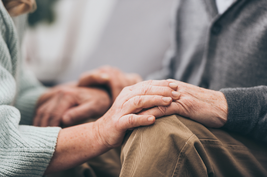 Seniors holding hands.