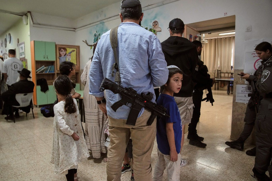 Israeli settlers line up to vote.