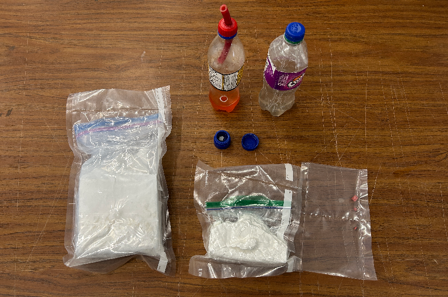 Cocaine and fentanyl seized in Moose Jaw, arrayed on a table.