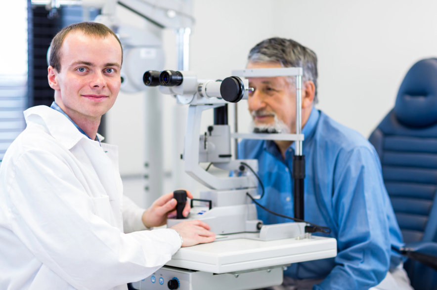A man has his eyes examined by an optometrist.