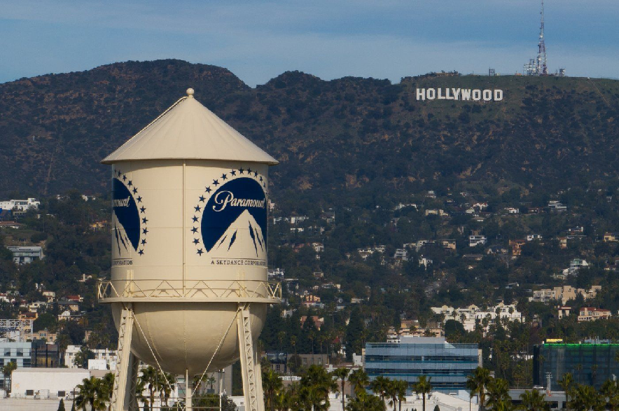 The Paramount Pictures water tower is seen in Los Angeles, Dec. 18, 2025, with the Hollywood sign in the distance.
