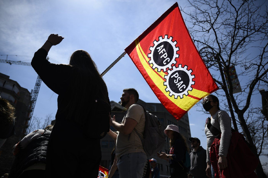 Members of the Public Service Alliance of Canada (PSAC) stand at a picket line outside Place du Portage in Gatineau, Que., on Friday, April 28, 2023.