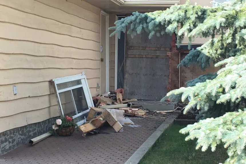 No charges after SUV plows into house