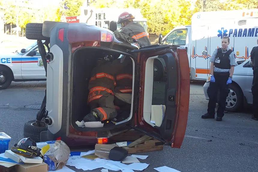 Firefighters pull one person out of vehicle after collision