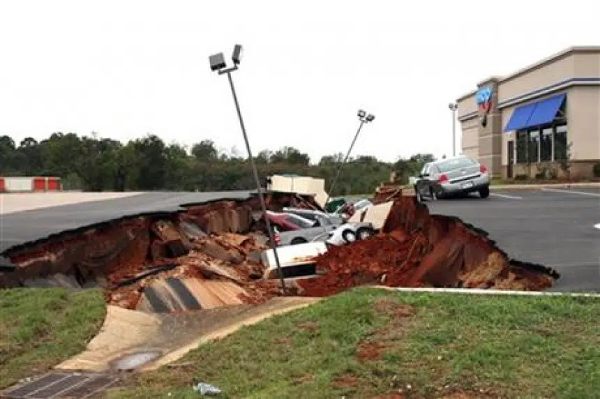 Restaurant parking lot cave-in swallows 12 cars in Mississippi