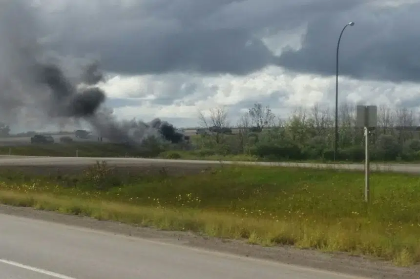 2 men taken to hospital after vehicle rolls, catches fire by Belle Plaine, Sask.