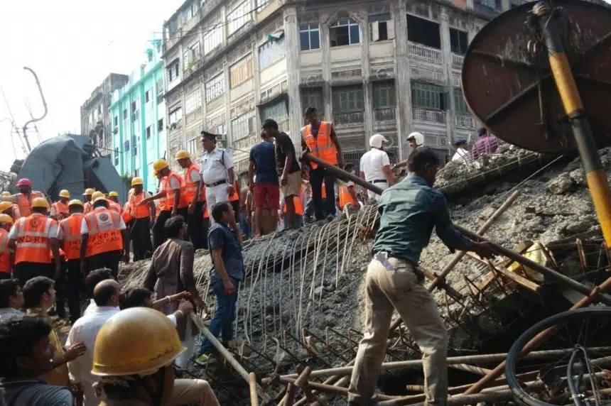 21 killed, many trapped in overpass collapse in India