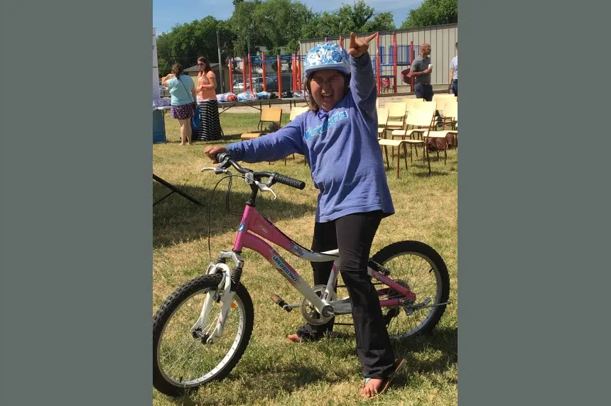 Rock 102 gives donated bicycles to kids in need