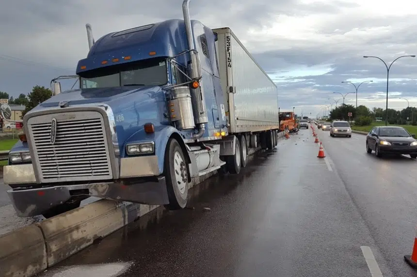 Update: No charges after semi-trailer stuck  on concrete barrier