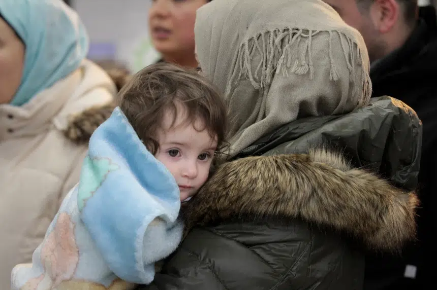 Applause, song welcome 3 Syrian refugee families to Saskatoon