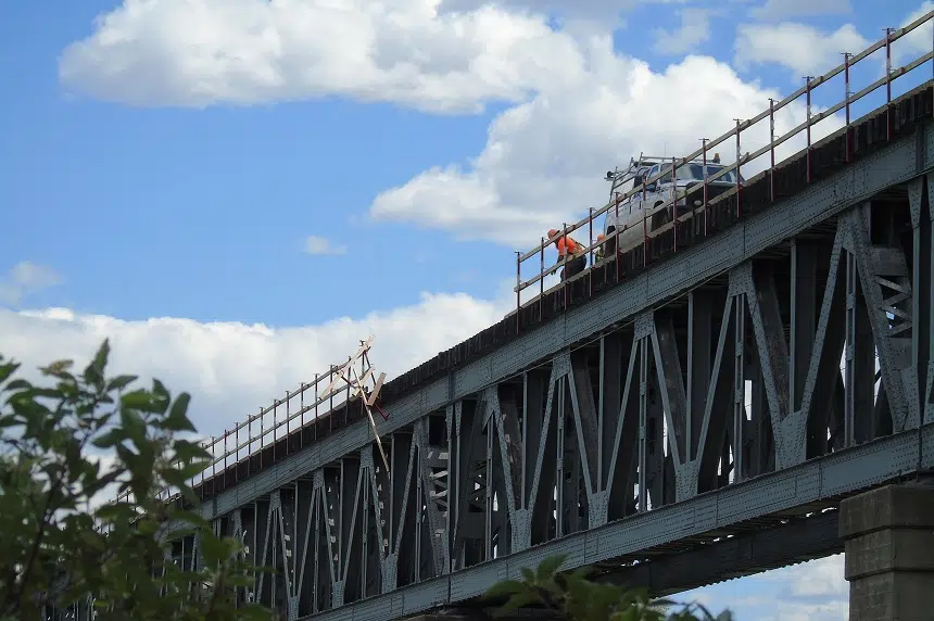 Guardrail falls off Train Bridge, damages police cruiser