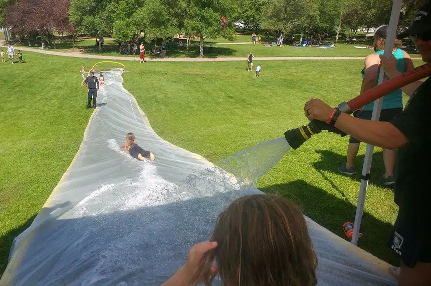 Firefighters, kids beat the heat with hydrant slip'n slide