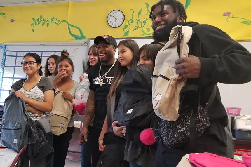 Riders' Jovon Johnson delivers back-to-school supplies 