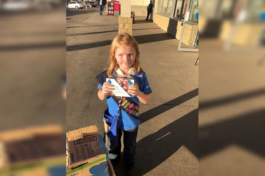 Edmonton girl guide sells out of cookies in front of cannabis store on first day