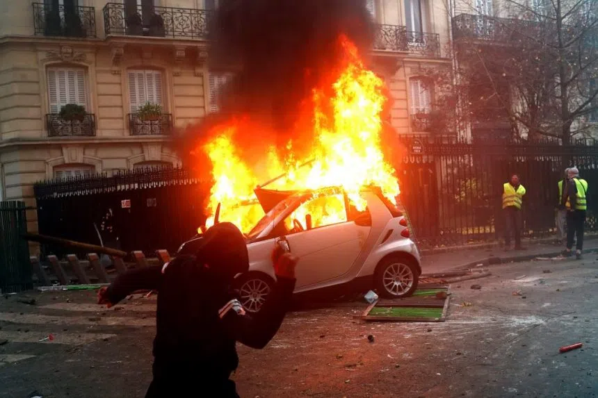 Macron tours damaged Arc de Triomphe after Paris hit by riot