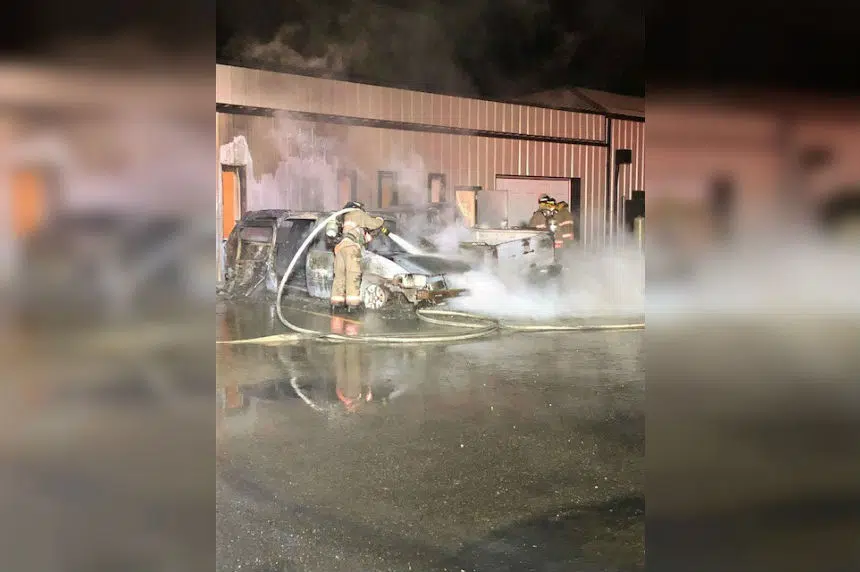 Fire destroys 2 vehicles causes damage to north end business
