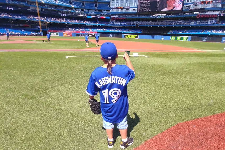 Standing Buffalo boy throws Blue Jays opening pitch