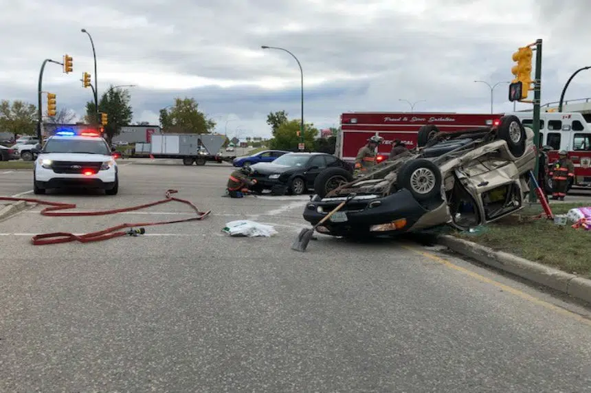 Fire crews rescue driver from flipped van in Saskatoon