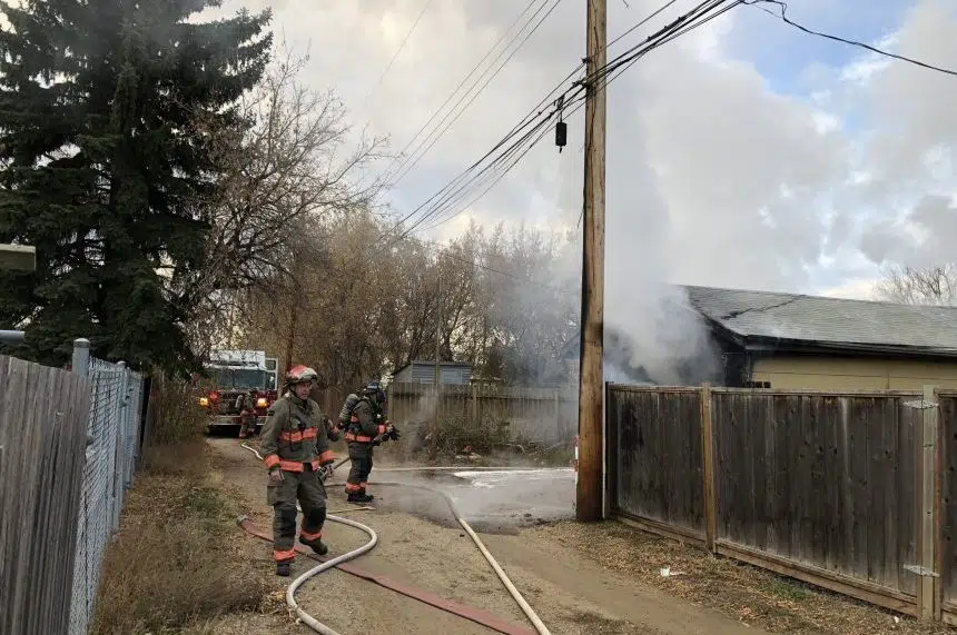 Morning fire spreads from garage to power lines