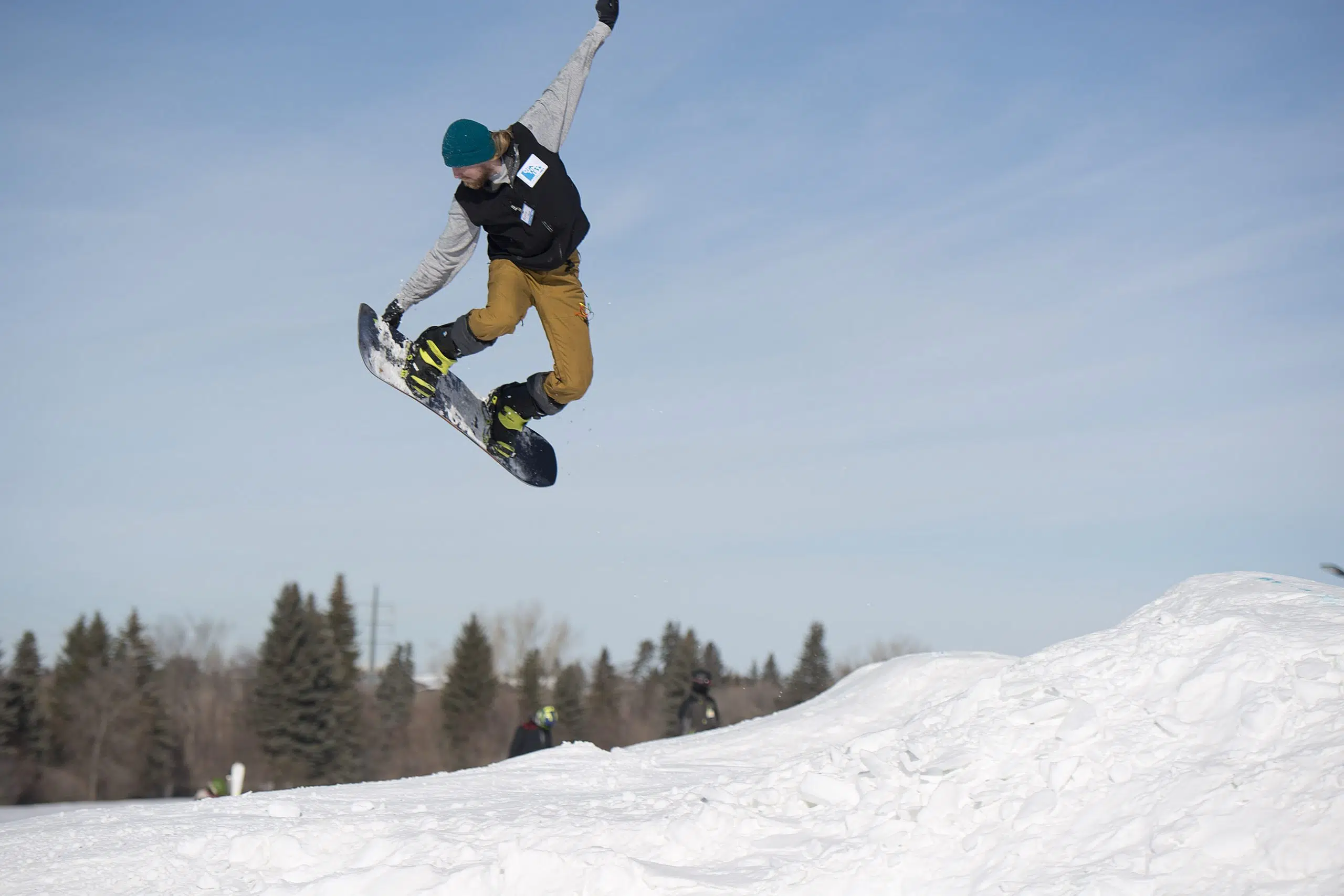 Snowboarders and skiers embrace snowy weather at Optimist Hill