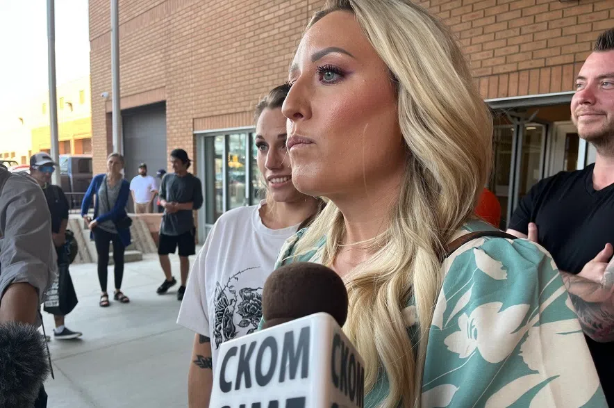 Caitlin Erickson speaks to the media outside Saskatoon's provincial courthouse during a previous court date.