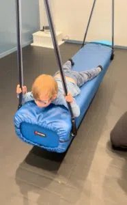 A child swings in the sensory gym at AIM Saskatoon (Alex Brown/650 CKOM)