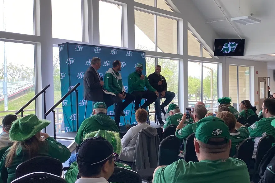 Riders personnel speak with fans ahead of the season