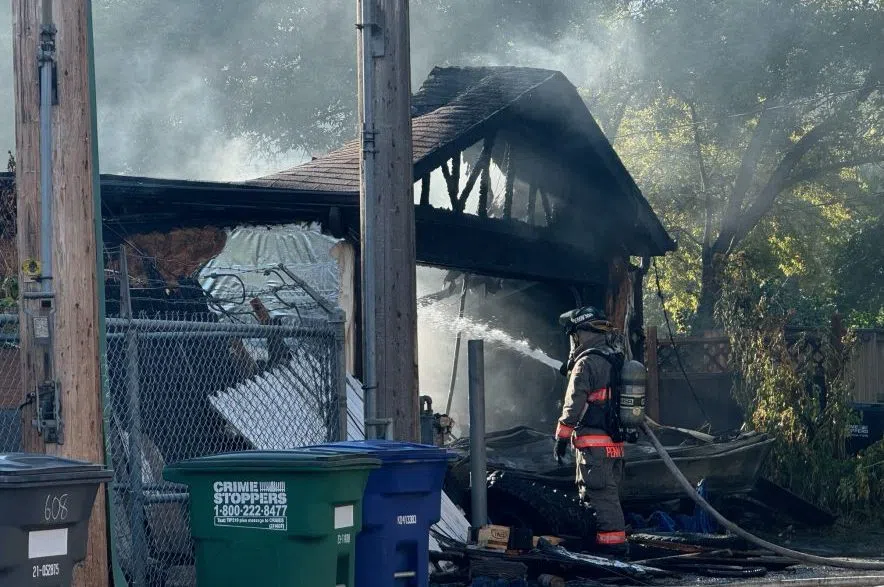 Residents on Avenue I North awoke to a loud boom on Sept. 17, 2024. A garage fire sent black smoke billowing into the back alley. Alex Brown/650 CKOM)