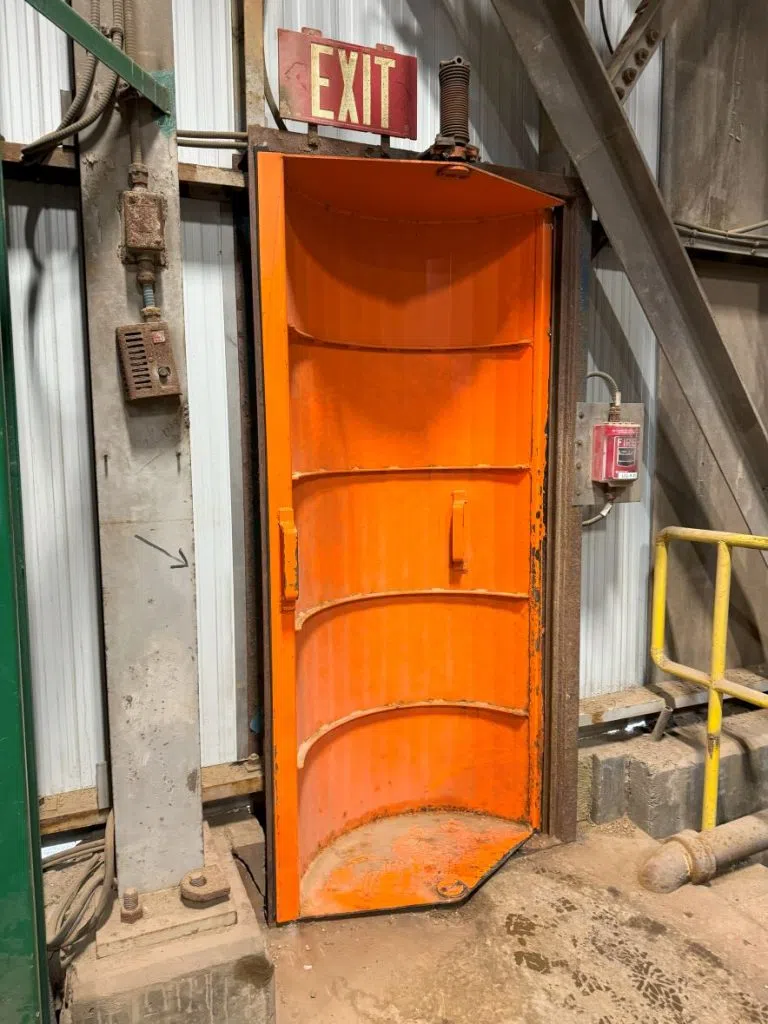 The orange revolving door is used by miners to enter into the site where they will take an ride one kilometre deep. (Céline Grimard/650 CKOM)