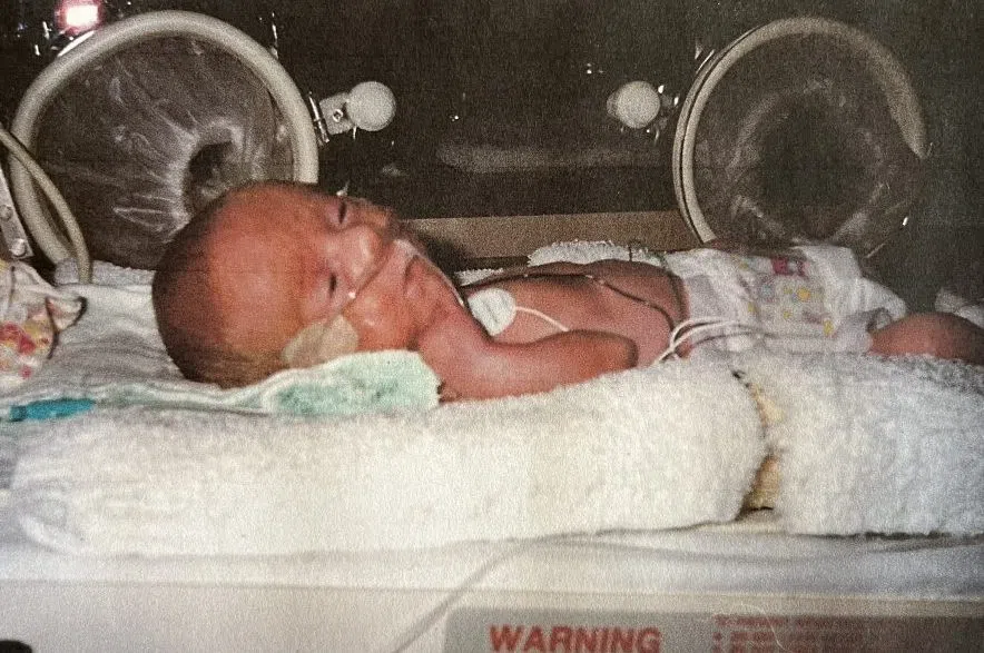 Baby Logan in an isolette in the NICU